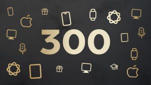 En la imagen aparece el número 300 en el centro con un color dorado sobre un fondo gris oscuro rodeado de siluetas doradas de productos Apple.